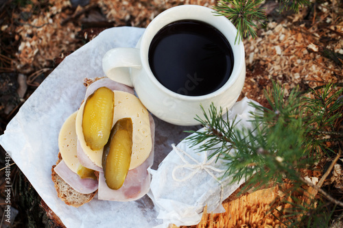 breakfast, afternoon tea in the woods. Coffee and sandwiches served in the woods on the tree. A break in the journey. A break at work in the forest.