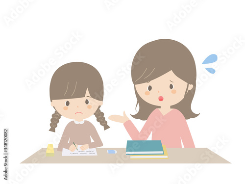 A girl learning at home while being told by her parents.