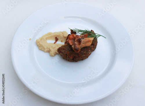 Mushroom Supplement on a cutlet on a white plate