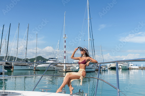 Portrait beautiful young woman leisure smile happy relax around yacht port at sea ocean for holiday vacation concept