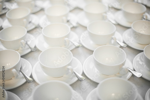 Group of empty coffee cups. White cup for service tea or coffee in breakfast or buffet and seminar event or catering.