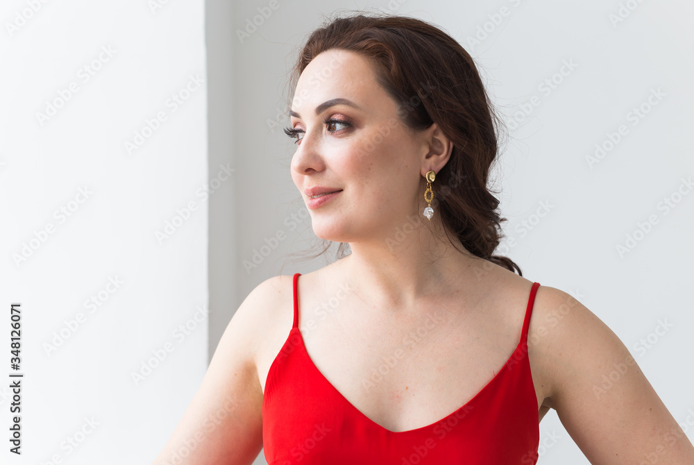 Close-up portrait of beautiful young woman with elegant hairstyle and luxurious jewelry and bijouterie. Close-up portrait of beautiful young woman with elegant hairstyle and luxurious jewelry and bijouterie.