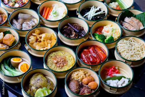 Variety of tasty Asian dishes top view packed on table