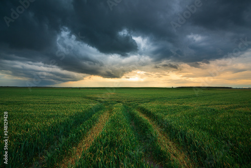 Storm clouds , dramatic dark sky over the rural field landscape photo