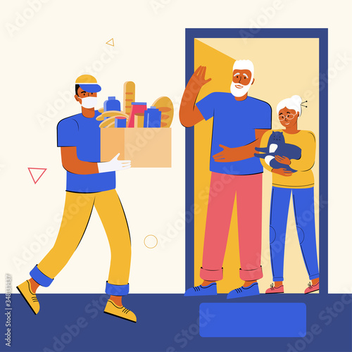 Help in quarantine. Volunteer in a medical mask and gloves delivered a box of food and goods to elderly people sitting at home. Protection against the spread of the virus. Social care concept.