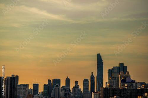 The high angle background of the city view with the secret light of the evening  blurring of night lights  showing the distribution of condominiums  dense homes in the capital community