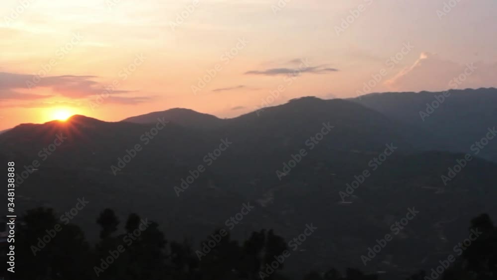 A sunset over the Nepalese Mountains. - Pan Shot A sunset over the Nepalese Mountains. - Pan Shot