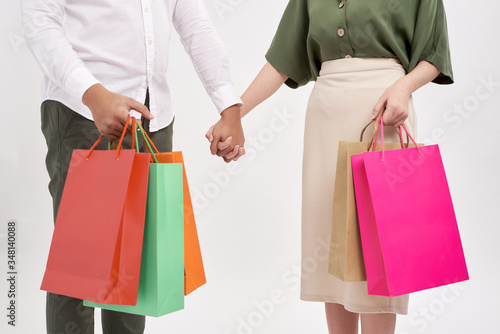 Closeup of man and woman holding their shopping bags