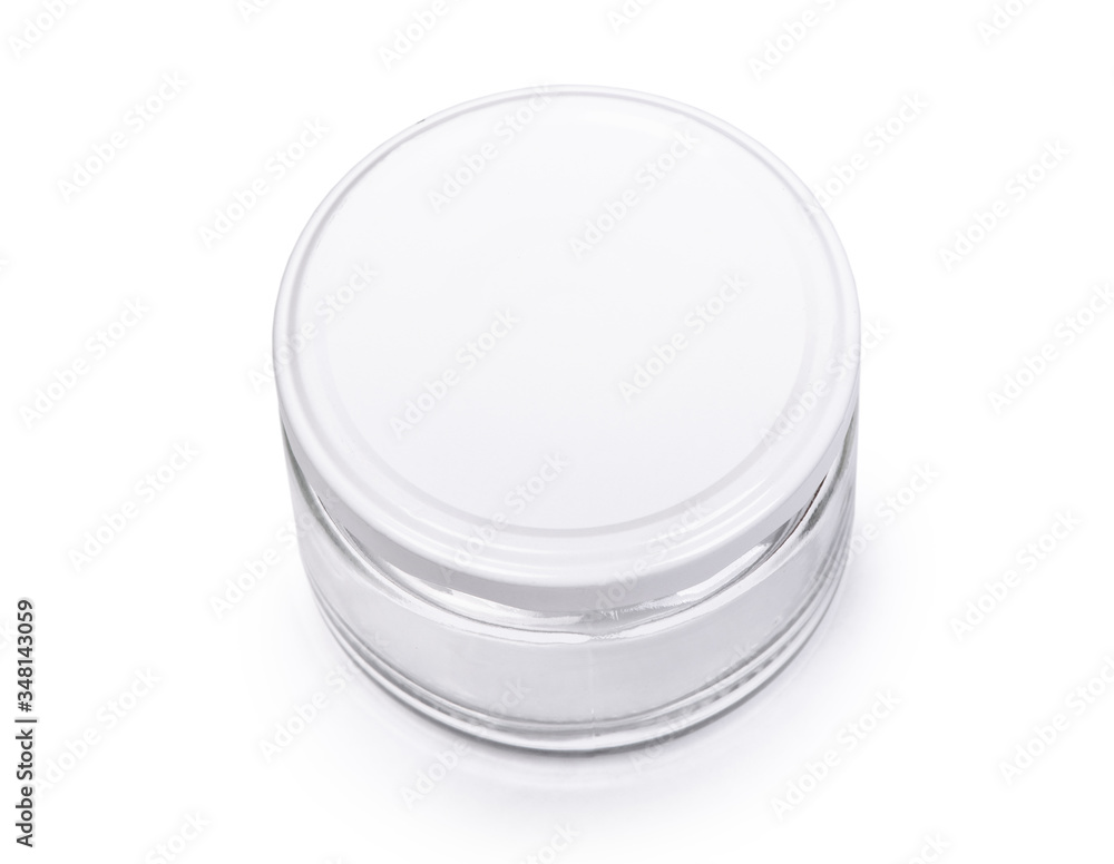 Small empty glass jar with a lid isolated Small empty glass jar with a lid isolated