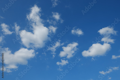 Little cumulus clouds on a blue sky. Background.