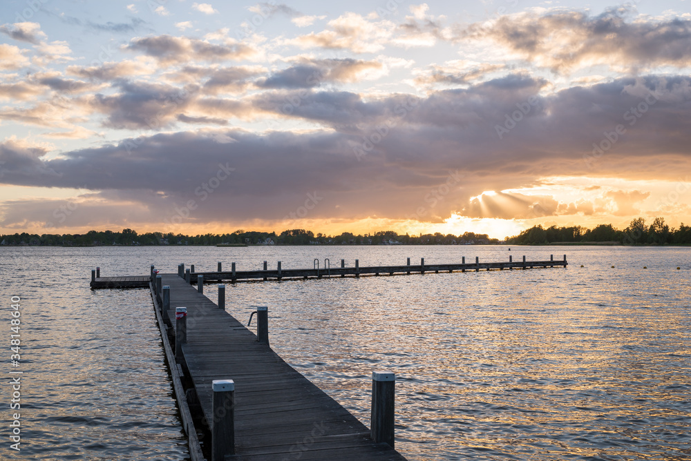 Scenic view at sunset of a pier in lake 