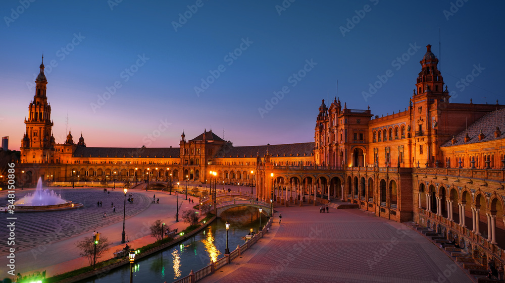 Seville, Spain - February 20th, 2020 - The famous plaza de Espana / Spain Square in Seville City Center with Architecture Details and beautiful centered fountain.