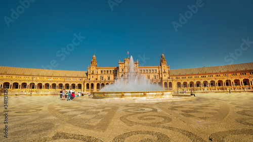 Seville, Spain - February 15th, 2020 - Plaza de Espana / Spain Square with the fountain in the foreground on a sunny day in Seville, Spain.