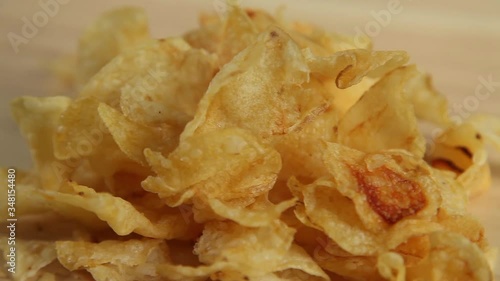 Chips potatoes on wooden background