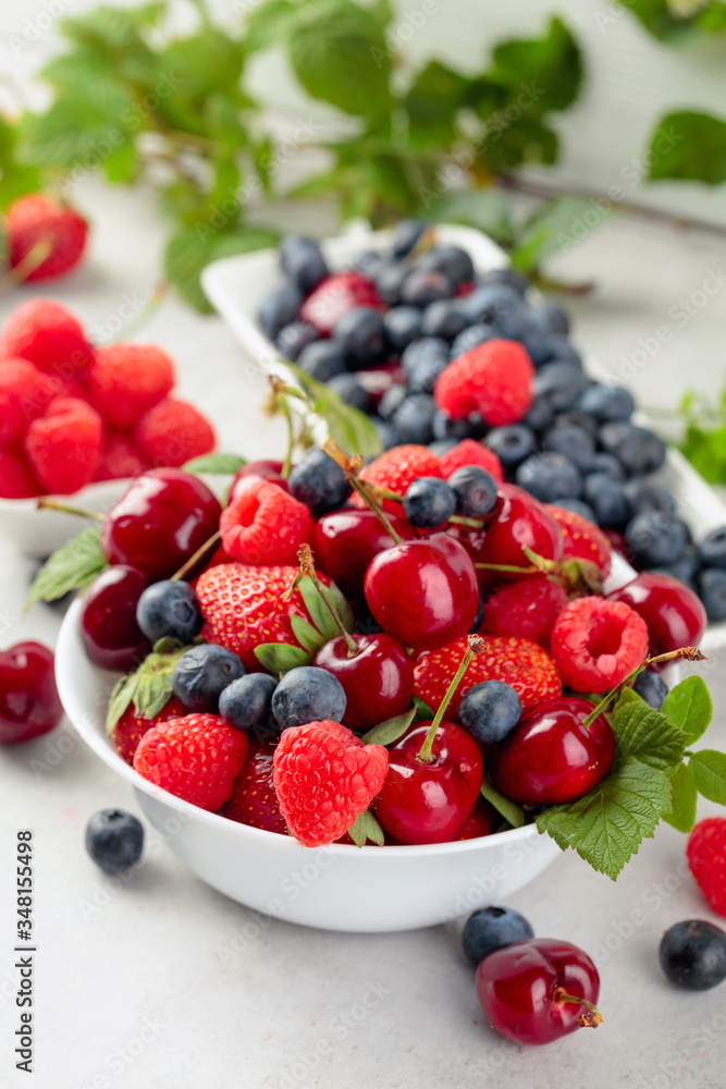 Various juicy berries with leaves. Various juicy berries with leaves.