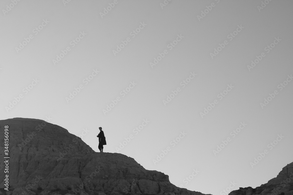 lonely silhouette on the top of the hill