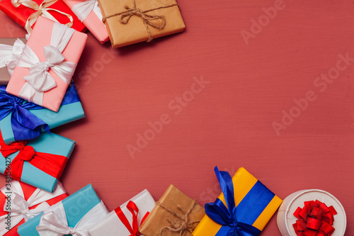 lots of multicolored gifts on the holiday background for inscriptions