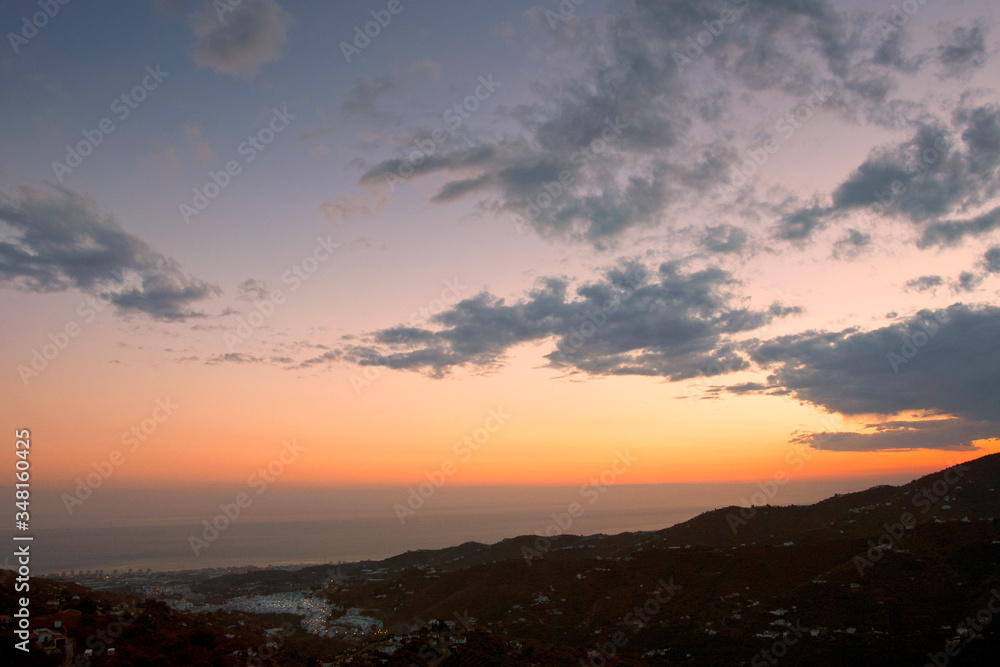 Sun Setting over Torrox Costa, Costa Tropical, The Axarquia, Malaga Province, Andalucia, Spain, Western Europe. Sun Setting over Torrox Costa, Costa Tropical, The Axarquia, Malaga Province, Andalucia, Spain, Western Europe.