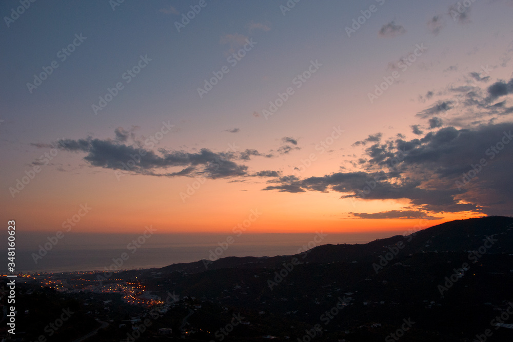Sun Setting over Torrox Costa, Costa Tropical, The Axarquia, Malaga Province, Andalucia, Spain, Western Europe. Sun Setting over Torrox Costa, Costa Tropical, The Axarquia, Malaga Province, Andalucia, Spain, Western Europe.