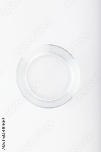 Glass bowl on white background. Empty bowl glass isolated. top view, copy space.
