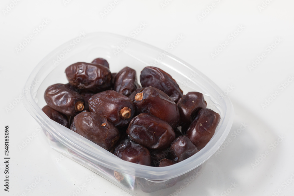 Dried dates fruits on white background, tasted sweet and chewy Dried dates fruits on white background, tasted sweet and chewy