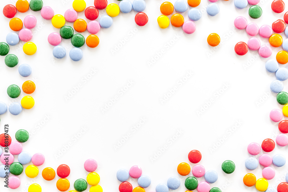 Color candy on white background top view frame copy space Color candy on white background top view frame copy space