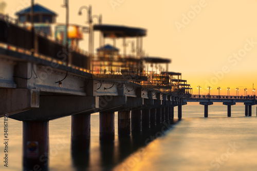 Baltic sea at beautiful sunset in Miedzyzdroje beach. Polish baltic coast. Famous city among the tourist. Pier at sunset