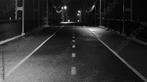 Empty bridge pathway at night