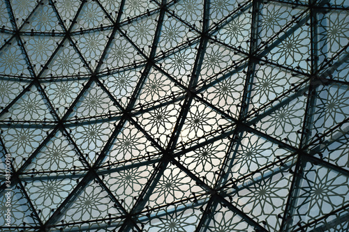 Glass roof cupola pattern formed by metal frame abstract background