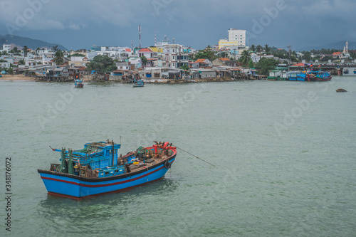 Fishing Boat At Anchor Off Poor Village In Nha Trang. Vietnam