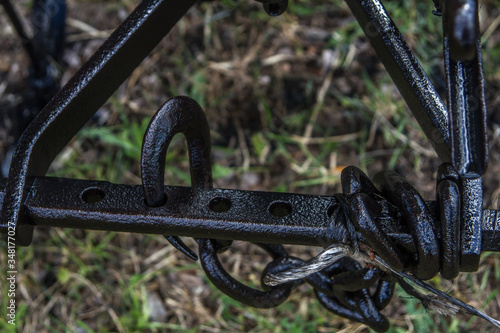 close details of ancient old iron plow for black oxen 