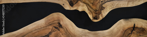 black epoxy resin panel with walnut, texture for design photo