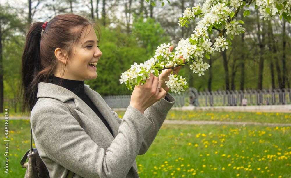 beautiful young brunette woman standing near the apple tree beautiful young brunette woman standing near the apple tree