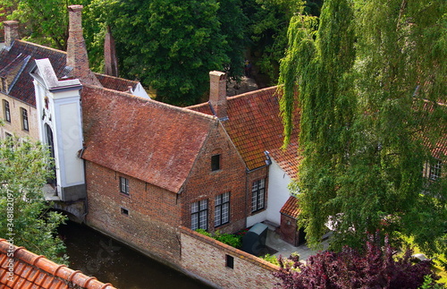 Belgium. Bruges. Panorama of Beguinage Ten Wijngaerde. The main gate, bridge, canal, house for housing and patio