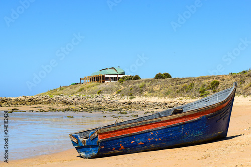 Immigrant dinghy boat stranded at the beach of Zahora  South Spain  near Africa.