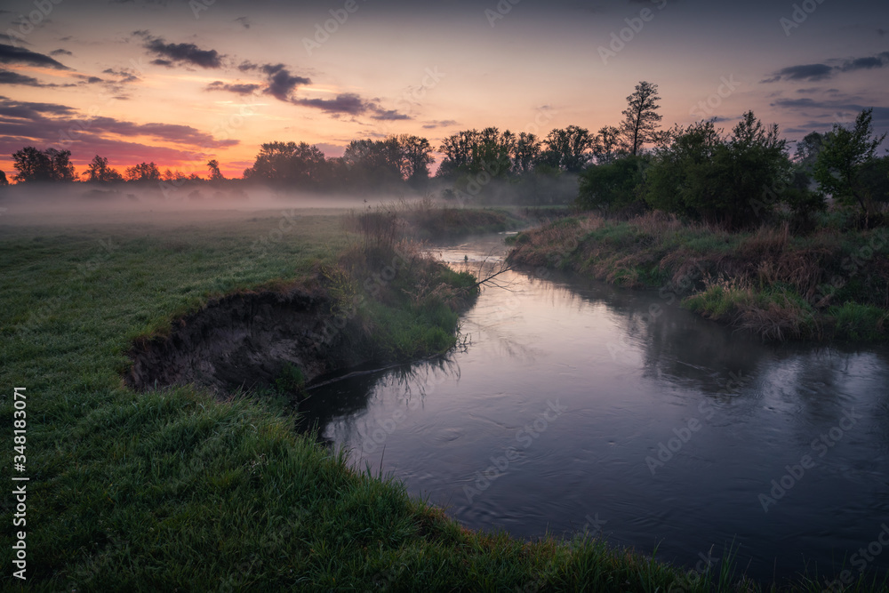 Foggy sunrise in the Jeziorka river valley near Piaseczno, Poland