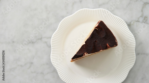 Piece of tiramisu cake on plate