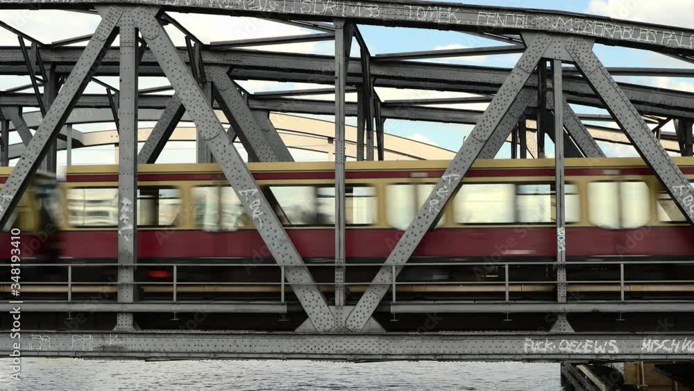 S-Bahn train going by over a bridge in Berlin in summer S-Bahn train going by over a bridge in Berlin in summer