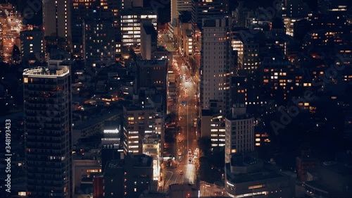 Wallpaper Mural City night view. A massive highway intersection traffic between buildings. Aerial view of orange lights metropolis at the evening. View skyline and lights from above.  Torontodigital.ca