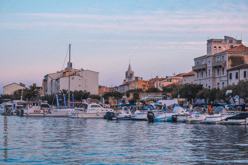 Picturesque coastal view of Rab town harbour bay. Rab island in Croatia is a popular tourist spot in summer.