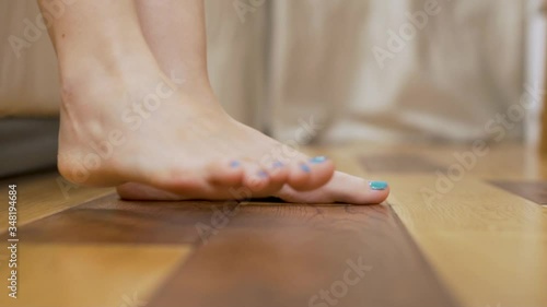 Wallpaper Mural The Woman Gets out of Bed in the Bedroom, the Girl goes to the Window to Open the Curtain. Close-up of the Girl's Legs. Torontodigital.ca