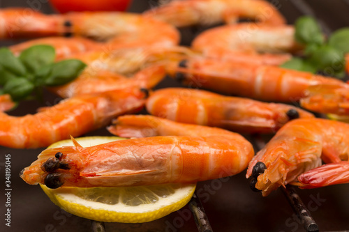 Grilled tiger shrimps on lemon. Healthy food.