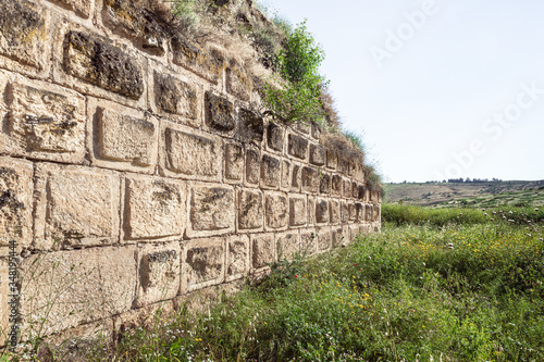 The ruins of the outer fortress wall of the Ateret fortress - Metzad Ateret - Qasr Atara - located next to the ford of the Jacob daughters on the Jordan River, in northern Israel