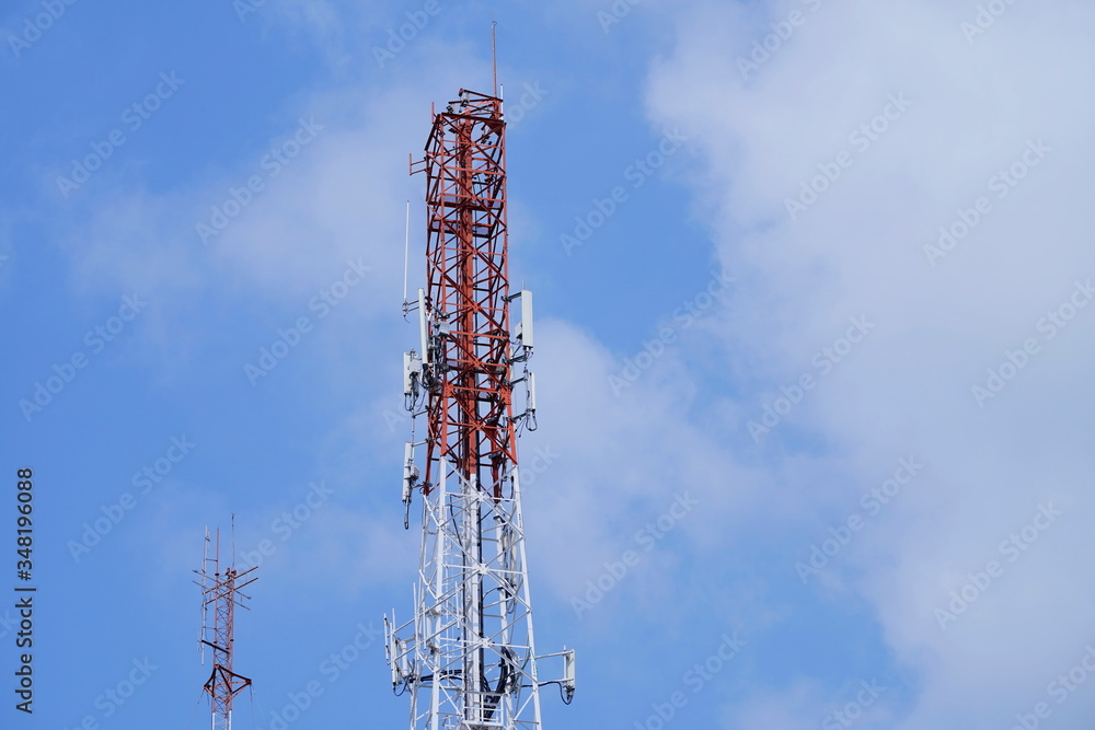Telecommunication tower of 4G and 5G cellular. Macro Base Station. Wireless Communication Antenna Transmitter. Telecommunication tower with antennas against blue sky background. Telecommunication tower of 4G and 5G cellular. Macro Base Station. Wireless Communication Antenna Transmitter. Telecommunication tower with antennas against blue sky background.