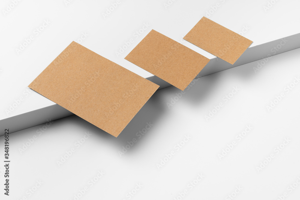 Empty craft business cards on white background. Close up. Empty craft business cards on white background. Close up.