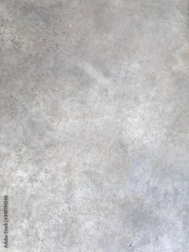 Cement concrete texture, gray stucco painted surface for flooring or interior decoration. Scratched and weathered empty space wallpaper