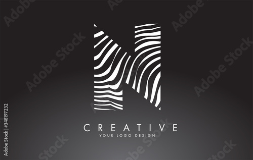 N Letter Logo Design with Fingerprint, black and white wood or Zebra texture on a Black Background.