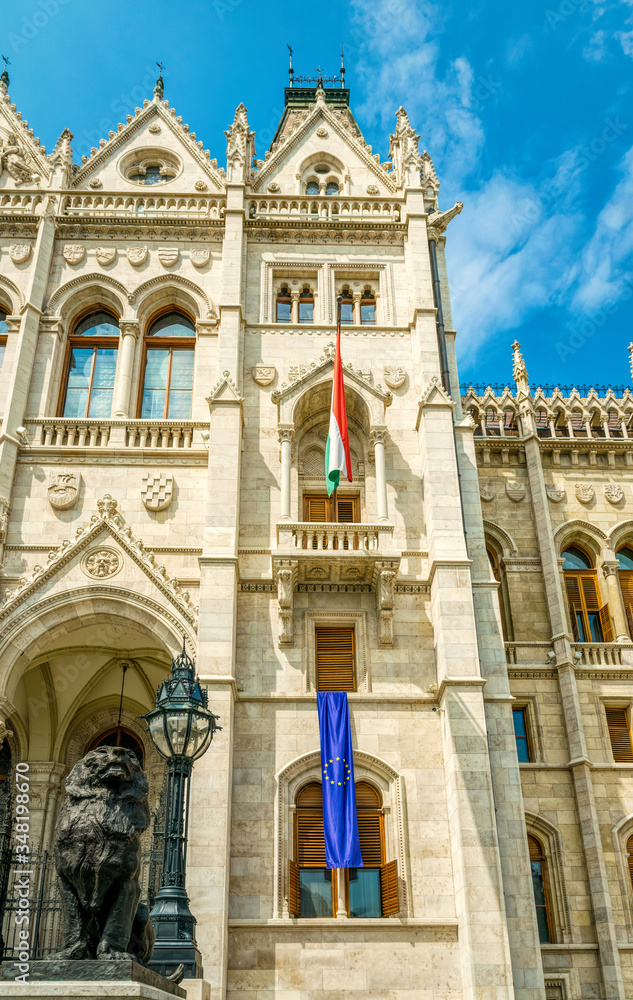 National flag of Hungary on the facade of the Hungarian parliament building