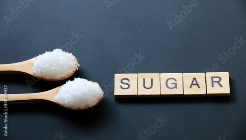 sugar text word made with wood blocks.Concept Diabetes Prevention
