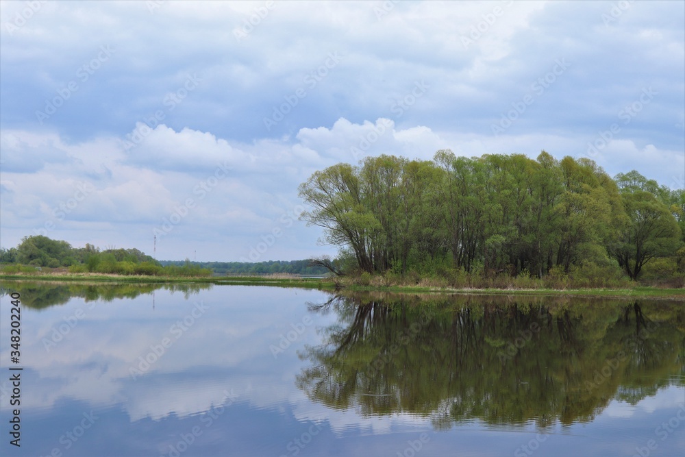 Beautiful river, trees, reflections in the homeland of Sergei Yesenin. Spring